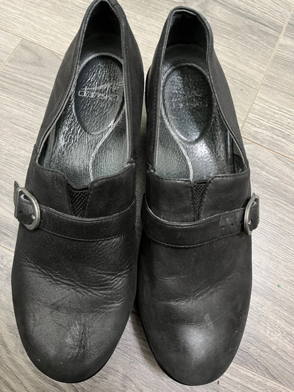 Dansko Black Leather Slip-On Loafers with Buckle Accent